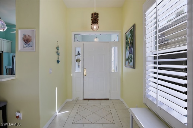 entryway featuring light tile patterned floors and a wealth of natural light