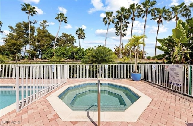 view of pool with a community hot tub