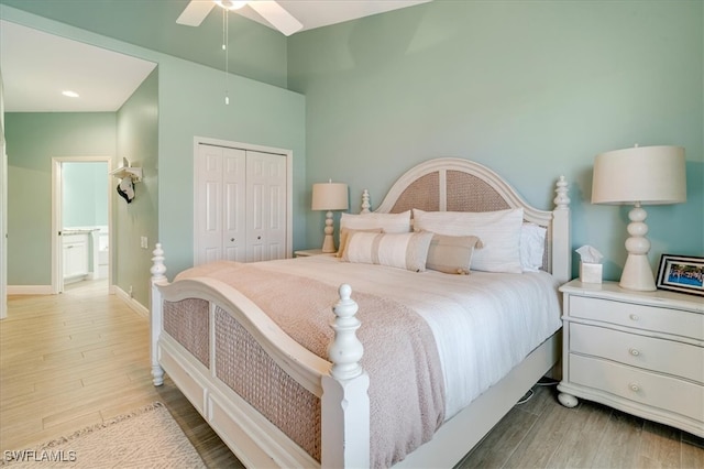 bedroom with a closet, ceiling fan, and light hardwood / wood-style flooring