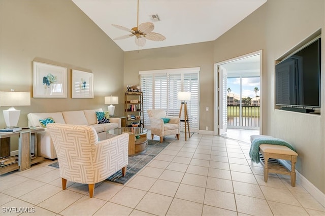 living room featuring ceiling fan, light tile patterned floors, and high vaulted ceiling