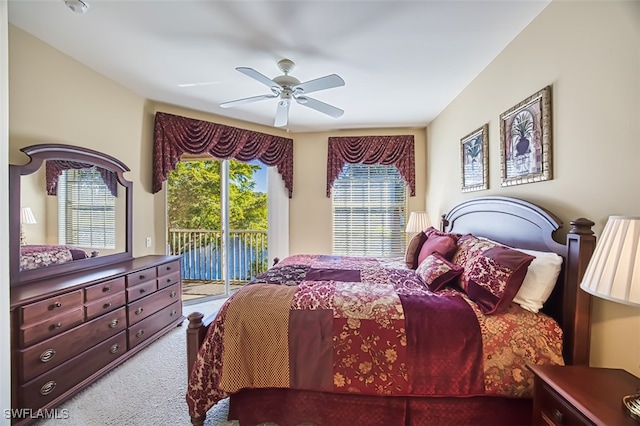 bedroom with access to outside, ceiling fan, and carpet