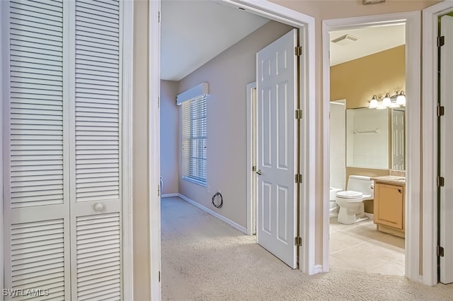 hallway with light tile patterned floors