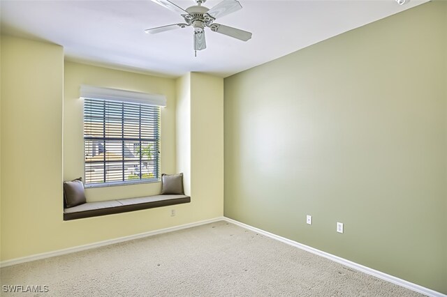 carpeted empty room with ceiling fan