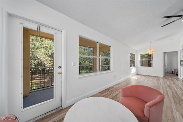 interior space with vaulted ceiling and ceiling fan