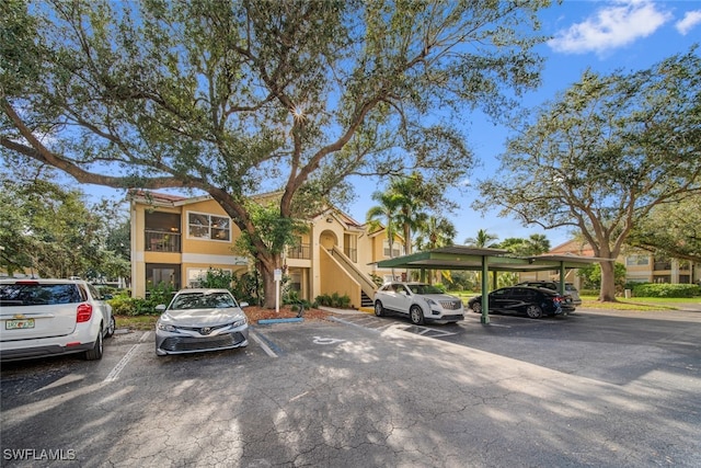 view of car parking featuring a carport