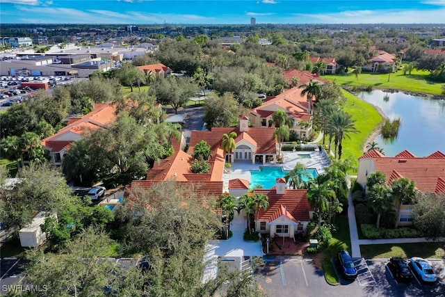 birds eye view of property with a water view