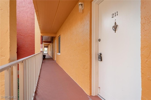 2366 E Mall Dr Unit 211, Fort Myers, FL 33901 - property entrance with stucco siding and a balcony