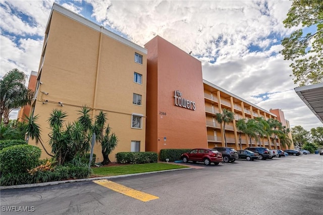 2366 E Mall Dr Unit 211, Fort Myers, FL 33901 - view of apartment building / complex with uncovered parking