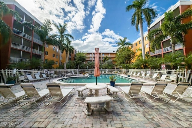 view of swimming pool featuring a patio area