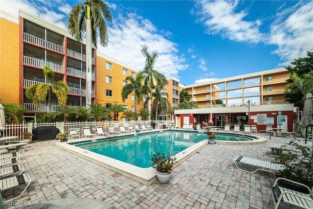 view of pool featuring a patio and area for grilling