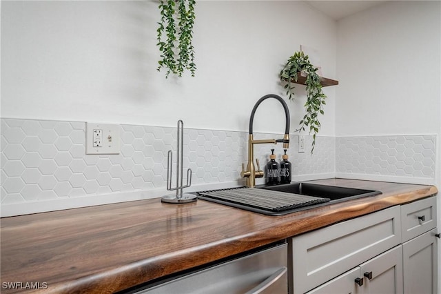 2366 E Mall Dr Unit 211, Fort Myers, FL 33901 - kitchen view of a sink, open shelves, dishwasher, and backsplash