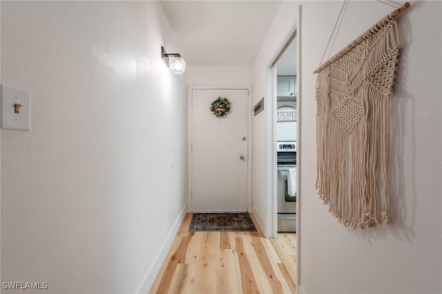 2366 E Mall Dr Unit 211, Fort Myers, FL 33901 - corridor featuring light wood-style flooring and baseboards