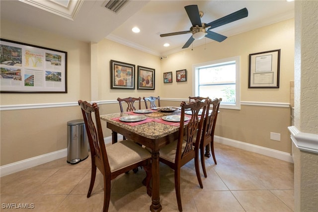 dining space with light tile patterned floors, ornamental molding, and ceiling fan