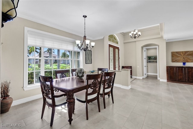 tiled dining area with ornamental molding and a notable chandelier