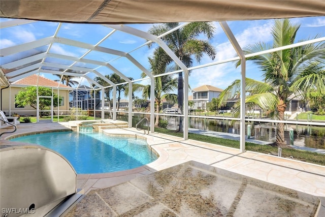 view of pool featuring an in ground hot tub, a patio, a water view, and glass enclosure