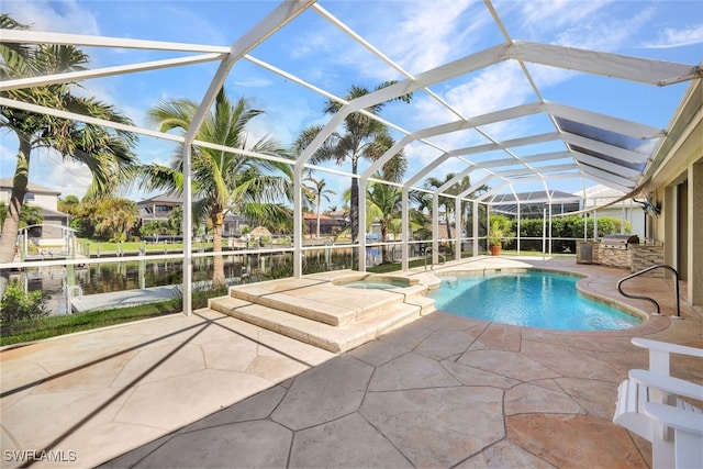 view of swimming pool featuring a water view, an in ground hot tub, and a patio