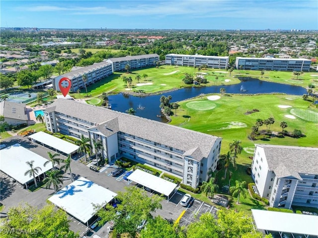 aerial view with view of golf course and a water view