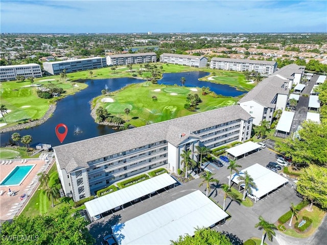 aerial view featuring a water view and golf course view