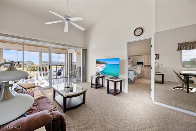 living room featuring carpet, ceiling fan, and high vaulted ceiling