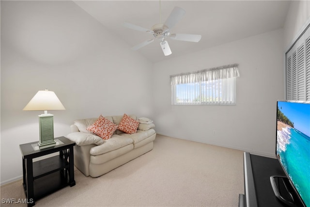 carpeted living room featuring vaulted ceiling and ceiling fan