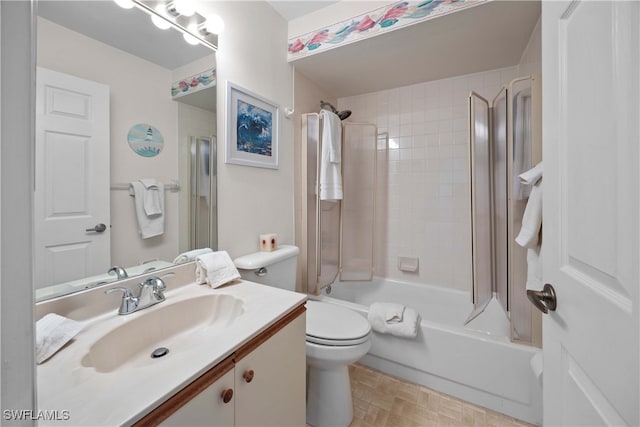 full bathroom with tiled shower / bath combo, toilet, and vanity