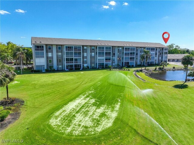 14871 Hole In 1 Cir Unit Ph1, Fort Myers, FL 33919 - view of home's community featuring a yard and a water view