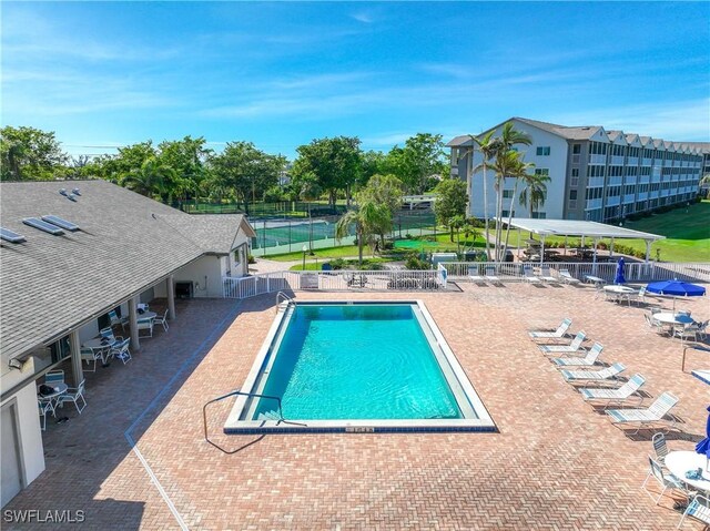 14871 Hole In 1 Cir Unit Ph1, Fort Myers, FL 33919 - community pool with a patio