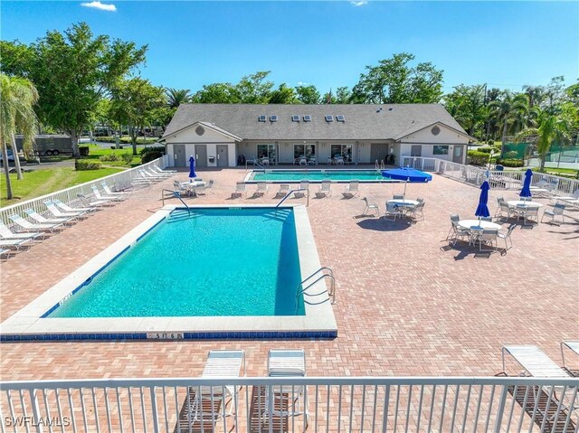 14871 Hole In 1 Cir Unit Ph1, Fort Myers, FL 33919 - community pool featuring a patio area