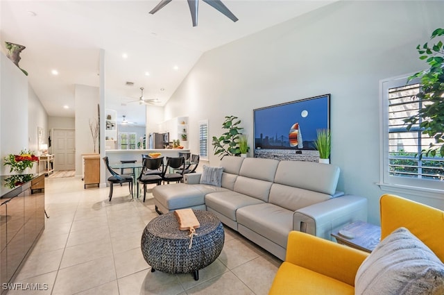 tiled living room with high vaulted ceiling