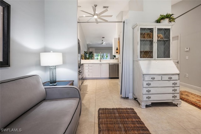 interior space with light tile patterned flooring and lofted ceiling