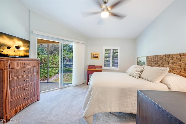 bedroom with access to exterior, vaulted ceiling, multiple windows, and ceiling fan