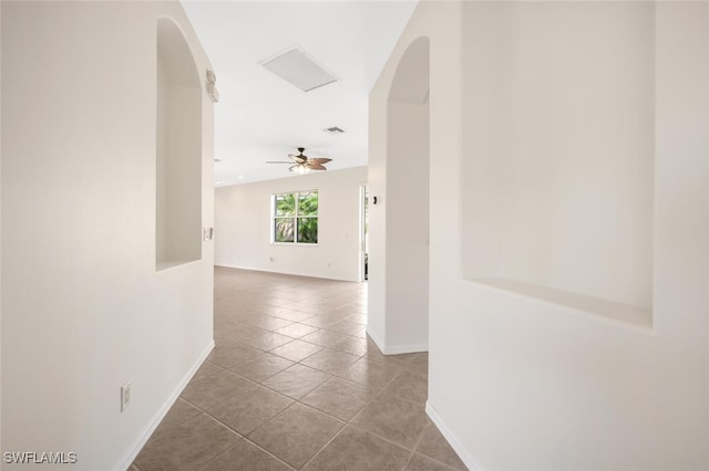 hallway with light tile patterned floors