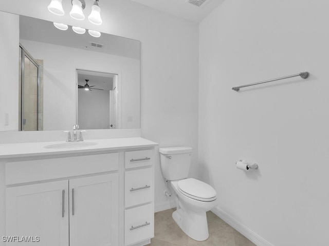 bathroom with tile patterned floors, walk in shower, vanity, ceiling fan, and toilet