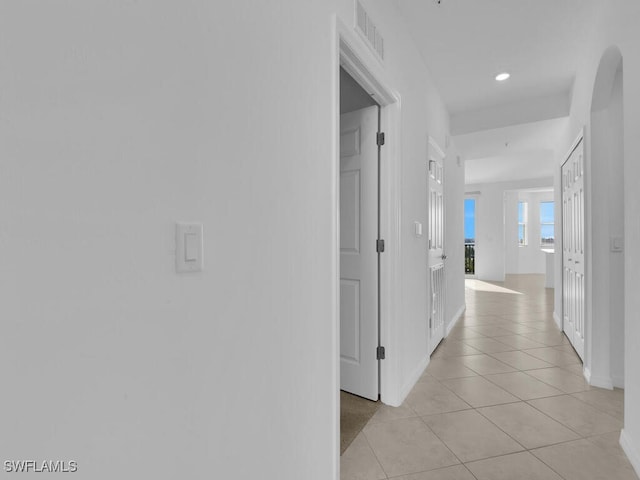 hallway featuring light tile patterned flooring