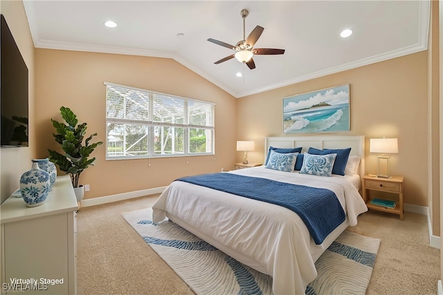 carpeted bedroom featuring ceiling fan, lofted ceiling, and crown molding