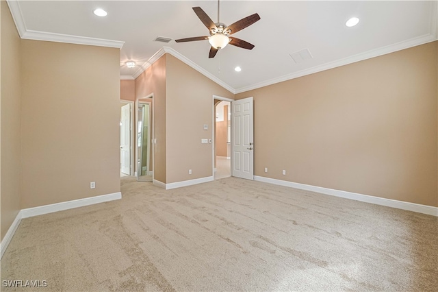 carpeted spare room with crown molding, ceiling fan, and vaulted ceiling