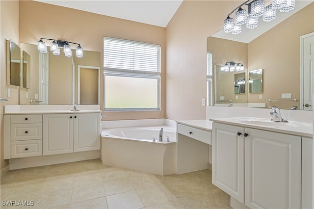 bathroom with vanity, a tub to relax in, tile patterned floors, and vaulted ceiling