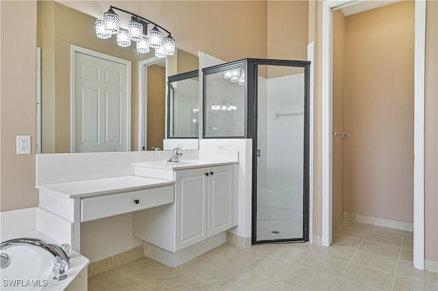 bathroom featuring tile patterned floors, vanity, and shower with separate bathtub