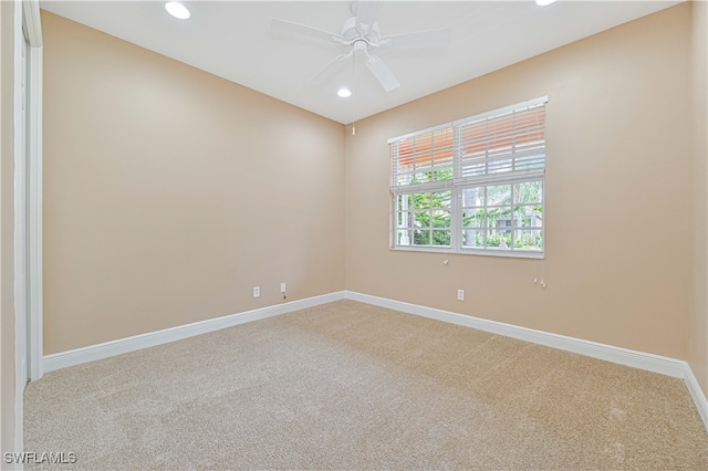 empty room with carpet flooring and ceiling fan