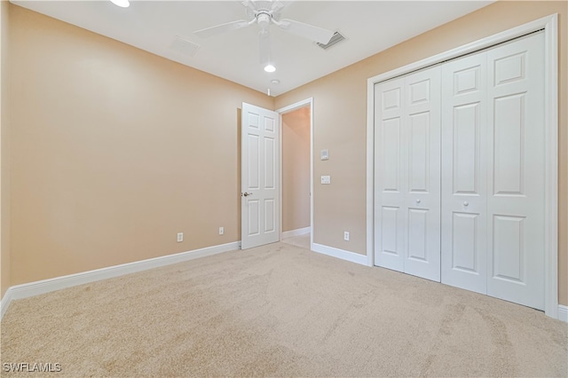 unfurnished bedroom featuring carpet flooring, ceiling fan, and a closet