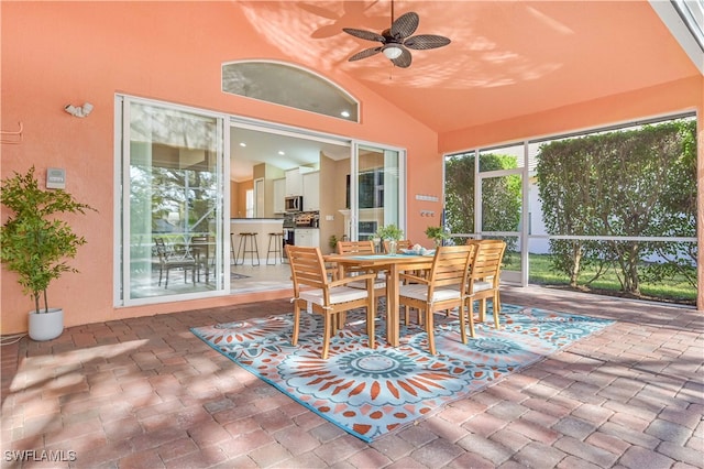 sunroom with vaulted ceiling and ceiling fan