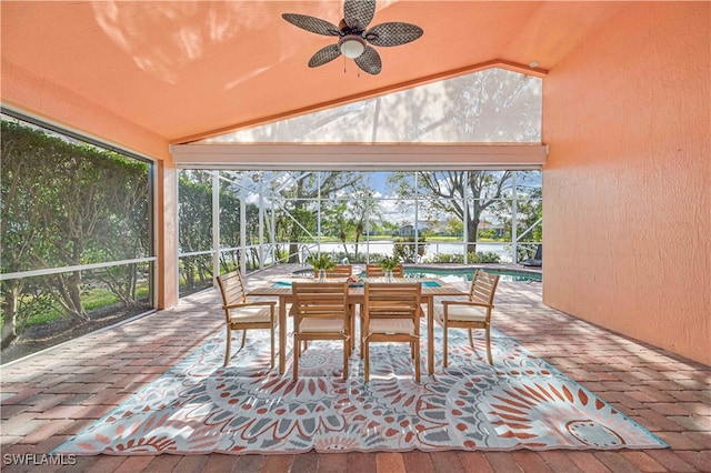 sunroom featuring vaulted ceiling and ceiling fan