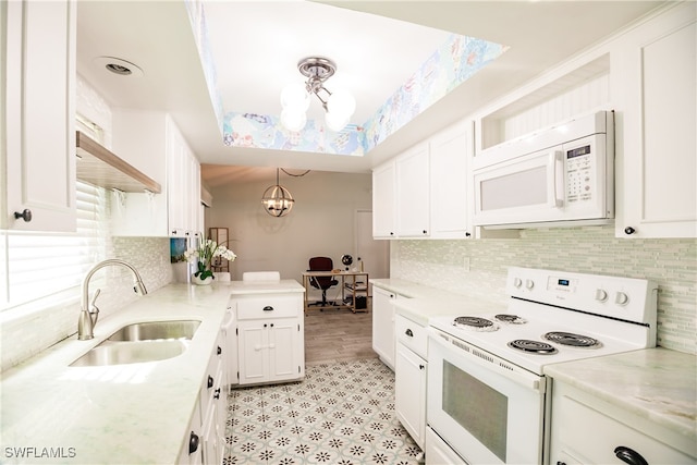 kitchen with sink, a notable chandelier, pendant lighting, white appliances, and white cabinets