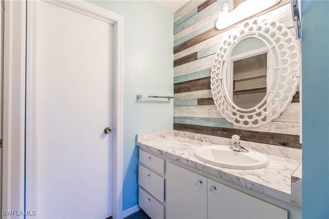 bathroom with vanity and tasteful backsplash