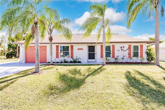 single story home featuring a front yard and a garage