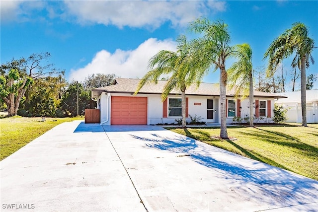 single story home featuring a garage and a front yard