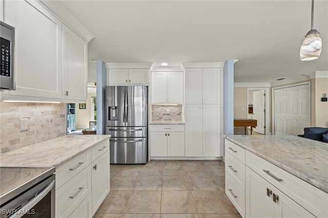 kitchen featuring white cabinetry, light stone countertops, crown molding, pendant lighting, and appliances with stainless steel finishes