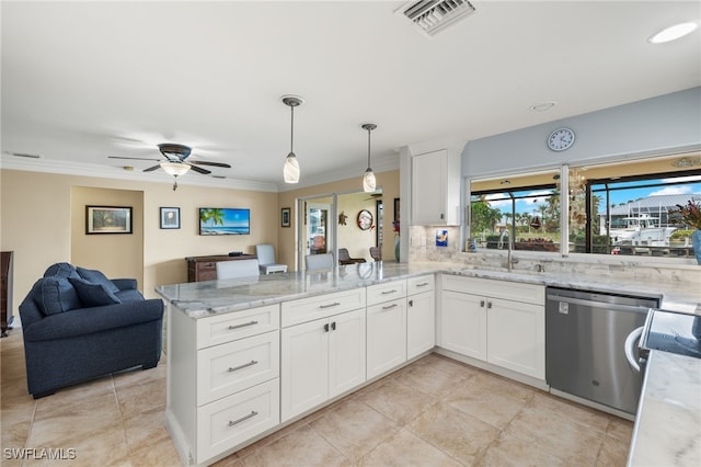 kitchen featuring sink, stainless steel dishwasher, kitchen peninsula, pendant lighting, and white cabinets