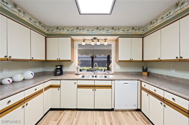 kitchen with white cabinetry, dishwasher, light hardwood / wood-style flooring, and sink