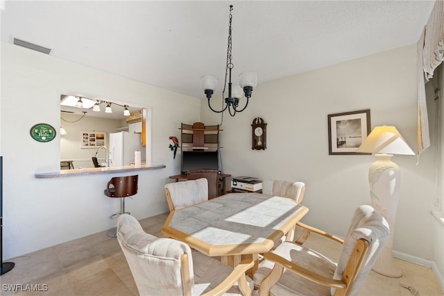 dining room featuring an inviting chandelier